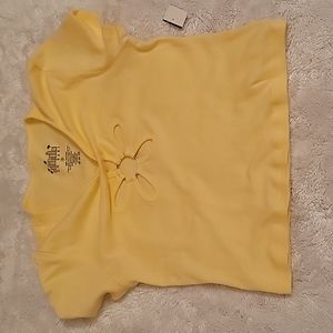 NWT light yellow crop top tee. Flower cut out on front. 100% cotton. Size small
